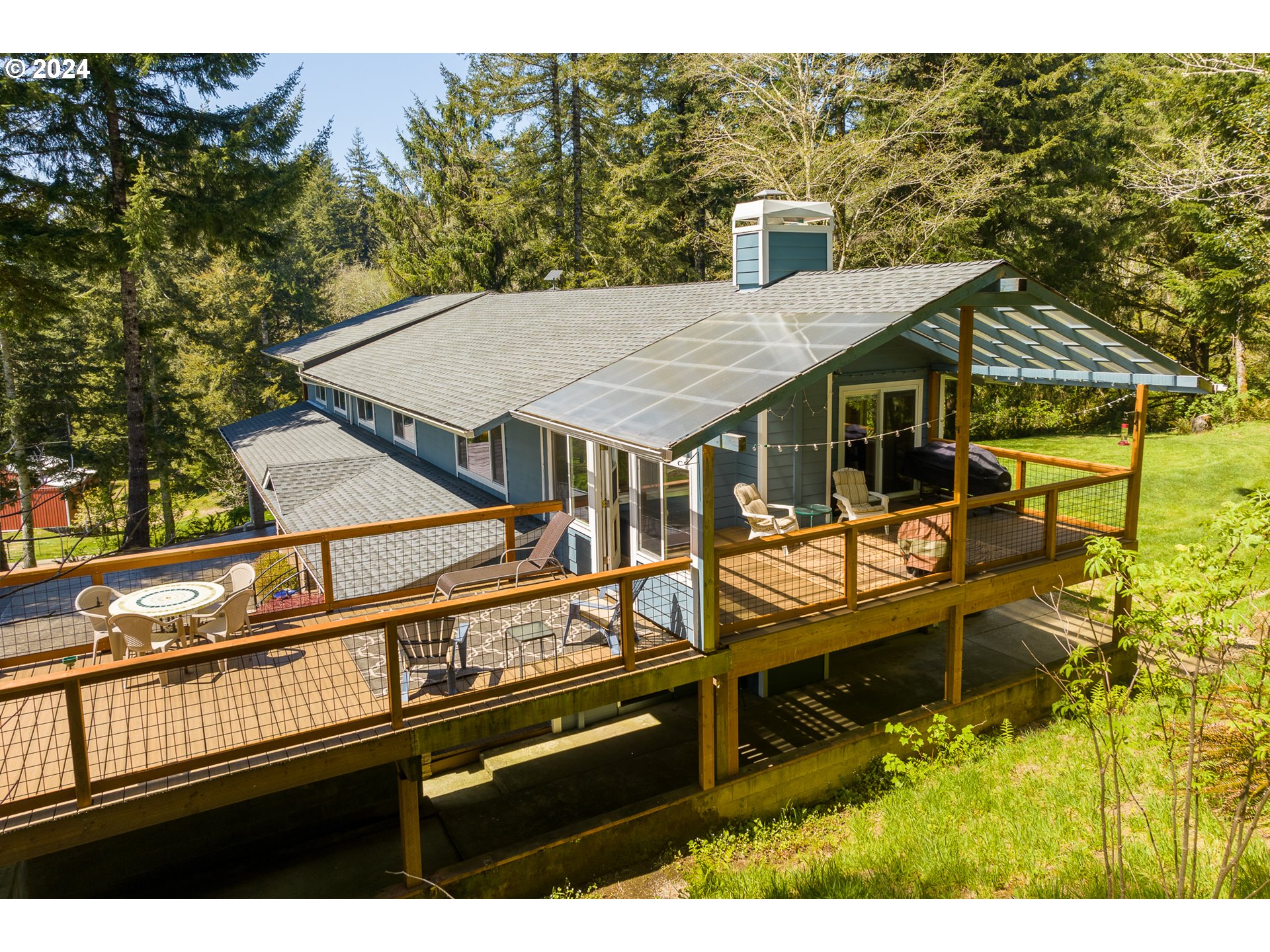 89915 Ben Bunch Road Florence, OR 97439 - Photo 27 of 33 a view of a house with pool and chairs