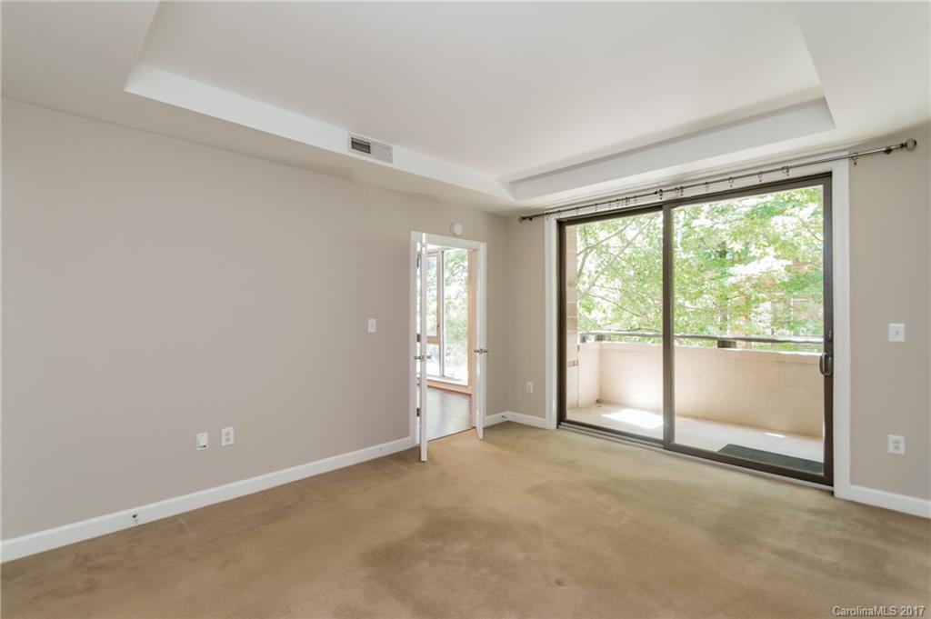 718 West Trade Street, Unit 211 Charlotte, NC 28202 - Photo 11 of 24 a view of an empty room with a window