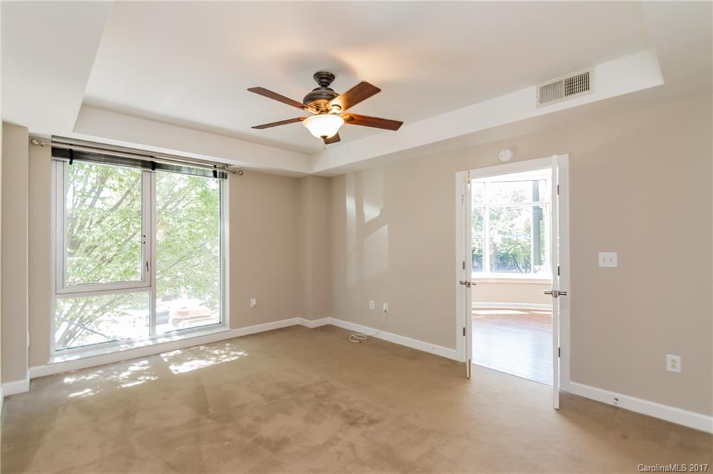 718 West Trade Street, Unit 211 Charlotte, NC 28202 - Photo 13 of 24 a view of an empty room with a window
