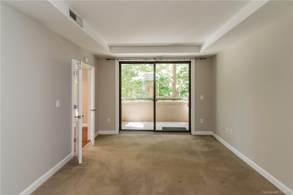 718 West Trade Street, Unit 211 Charlotte, NC 28202 - Photo 15 of 24 a view of an empty room and window