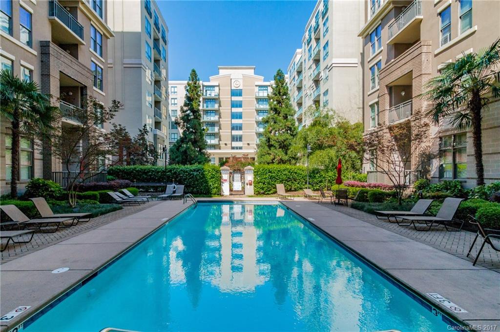 718 West Trade Street, Unit 211 Charlotte, NC 28202 - Photo 23 of 24 a swimming pool with outdoor seating and yard