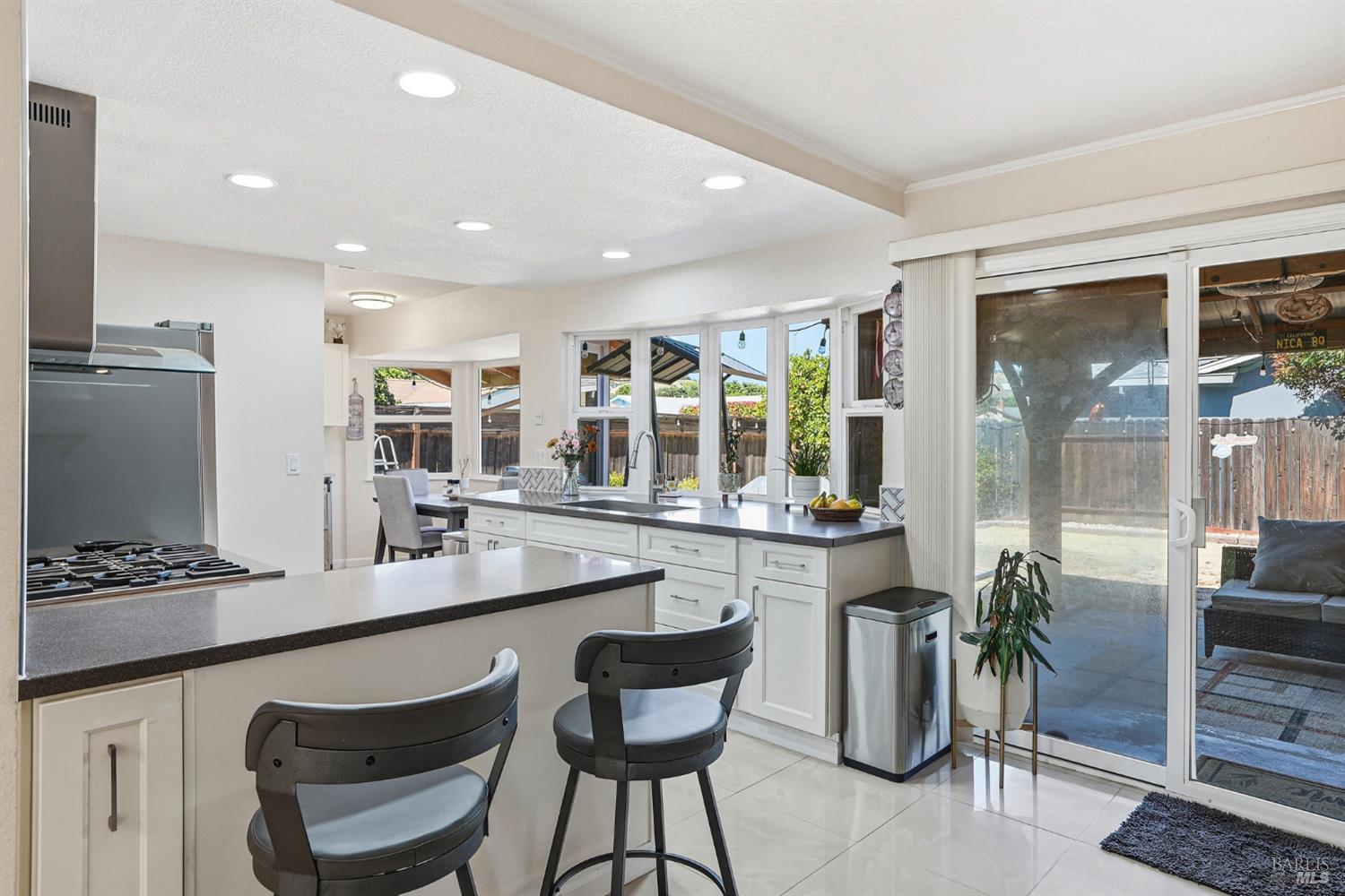 773 Blue Ridge Lane Vacaville, CA 95688 - Photo 16 of 44 a kitchen with granite countertop a table and chairs in it
