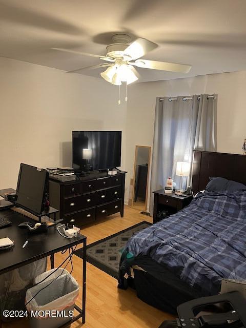 246 Greenwood Loop Road Brick, NJ 08724 - Photo 11 of 15 a bedroom with a bed and a flat screen tv