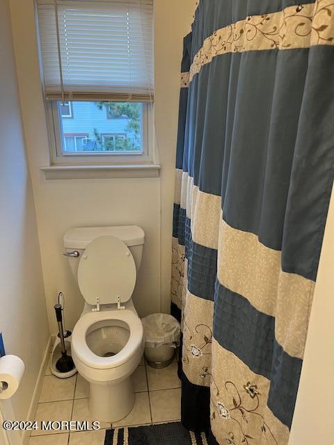 246 Greenwood Loop Road Brick, NJ 08724 - Photo 14 of 15 a bathroom with a toilet and a shower curtain