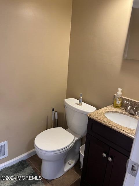 246 Greenwood Loop Road Brick, NJ 08724 - Photo 7 of 15 a bathroom with a granite countertop toilet a sink and mirror