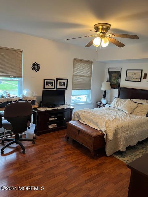 246 Greenwood Loop Road Brick, NJ 08724 - Photo 9 of 15 a bedroom with a bed and a chandelier