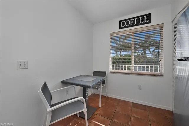 a view of a room that has a table and chair