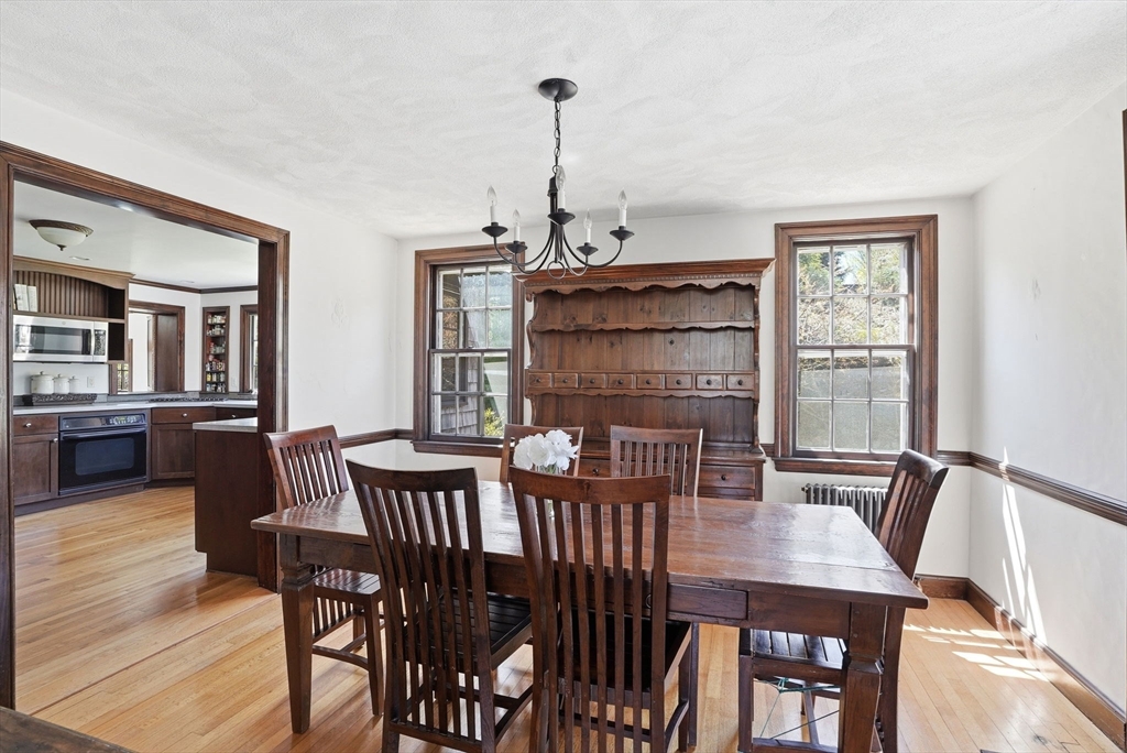 34 Governor Long Road Hingham, MA 02043 - Photo 4 of 37 a view of a dining room with furniture window and wooden floor