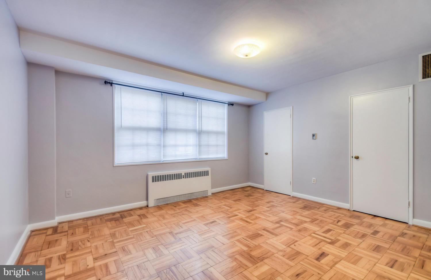 310 Ridgemede Road, Unit 203 Baltimore, MD 21210 - Photo 13 of 18 a view of an empty room and a window