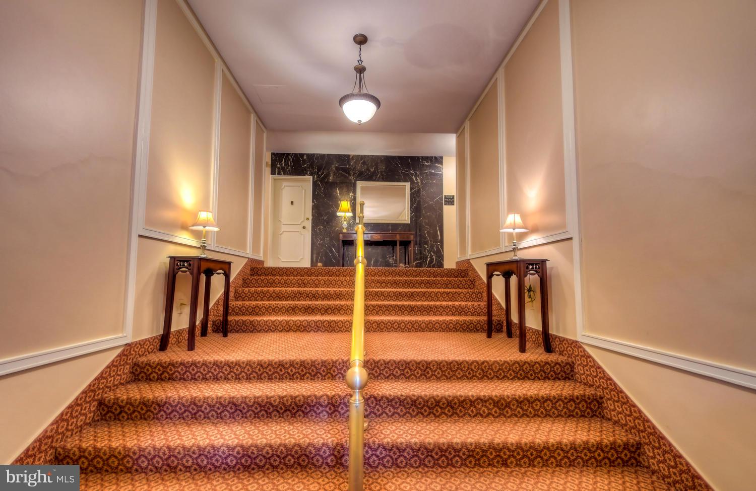 310 Ridgemede Road, Unit 203 Baltimore, MD 21210 - Photo 4 of 18 a view of entryway and hall with wooden floor