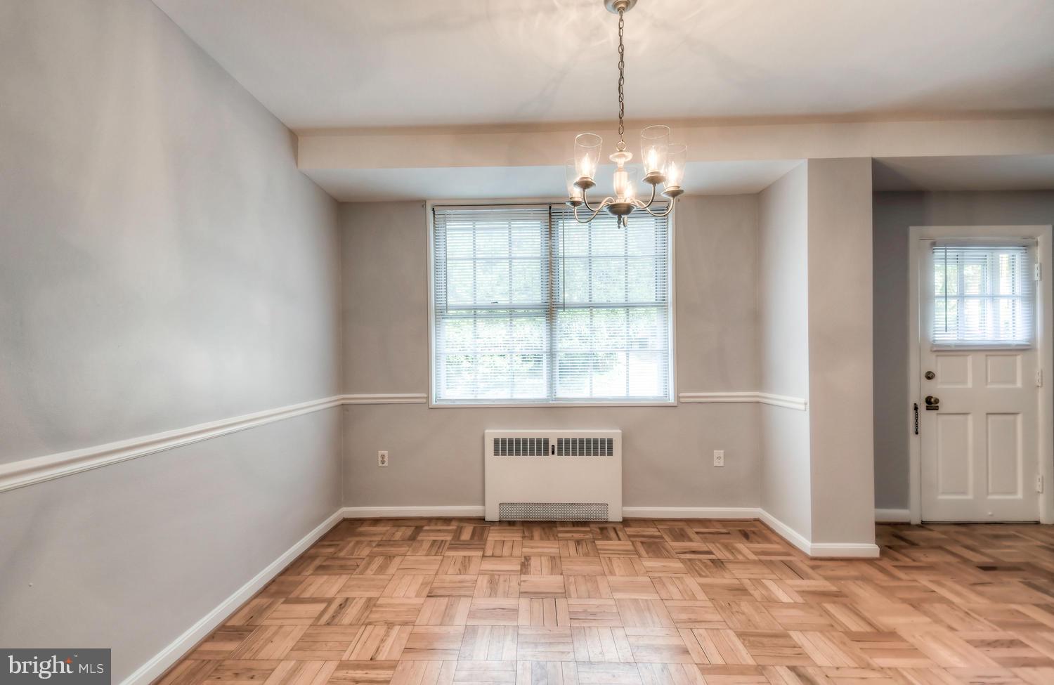 310 Ridgemede Road, Unit 203 Baltimore, MD 21210 - Photo 9 of 18 a view of an empty room with a window