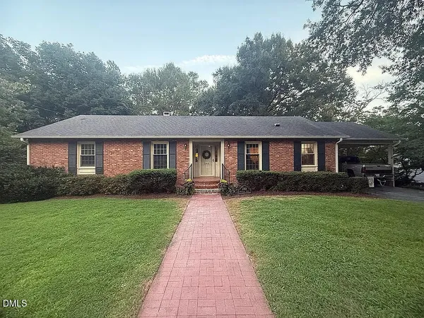 a front view of a house with yard