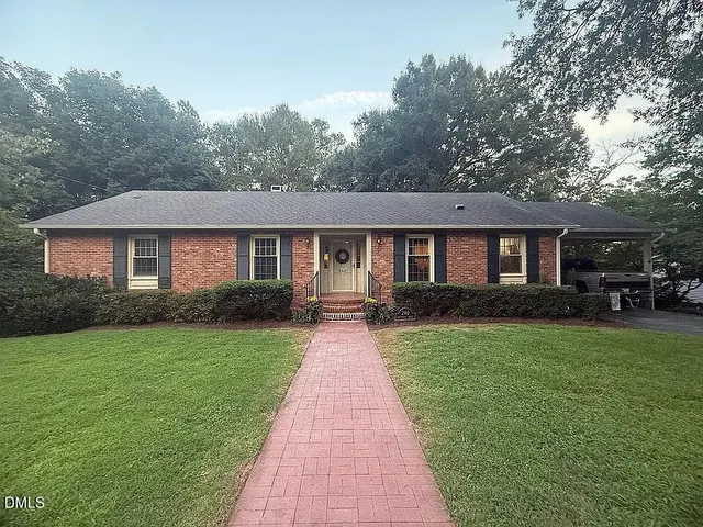 a front view of a house with yard