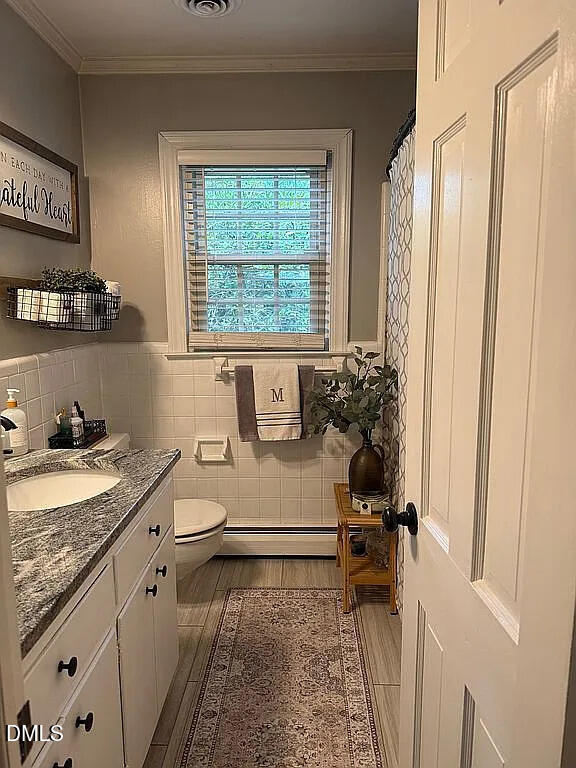 240 Crestwood Drive Roxboro, NC 27573 - Photo 11 of 25 a bathroom with a granite countertop sink and a window