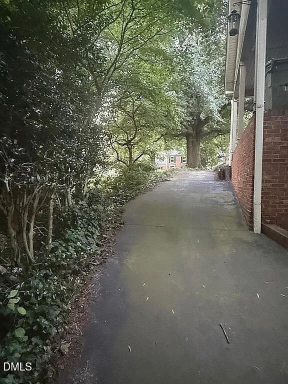 240 Crestwood Drive Roxboro, NC 27573 - Photo 23 of 25 a view of a street with a tree