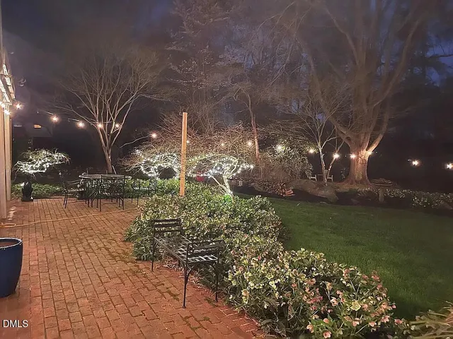 a view of a lake with a house in the background