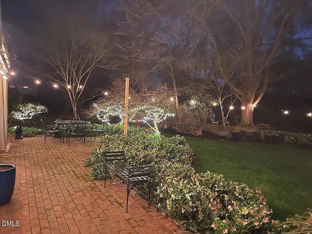 240 Crestwood Drive Roxboro, NC 27573 - Photo 25 of 25 a view of a lake with a house in the background