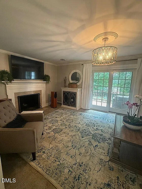 240 Crestwood Drive Roxboro, NC 27573 - Photo 6 of 25 a living room with furniture a fireplace and a flat screen tv