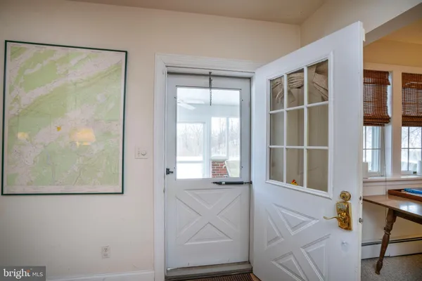 a bedroom with a bed and a mirror on dresser
