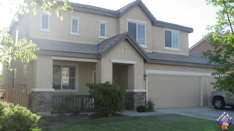 44741 Ruthron Avenue Lancaster, CA 93536 - Photo 1 of 18 a view of a house with a yard
