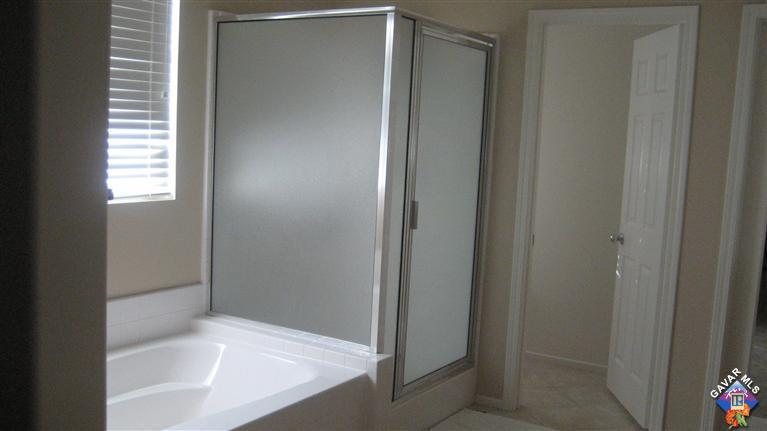 44741 Ruthron Avenue Lancaster, CA 93536 - Photo 15 of 18 a bathroom with a bathtub