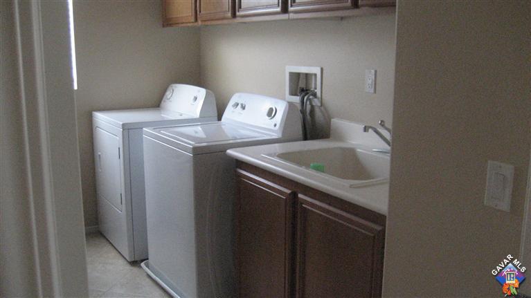 44741 Ruthron Avenue Lancaster, CA 93536 - Photo 18 of 18 a utility room with dryer and washer