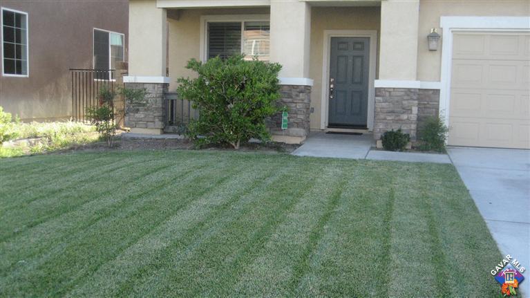 44741 Ruthron Avenue Lancaster, CA 93536 - Photo 4 of 18 a view of a house with a garden
