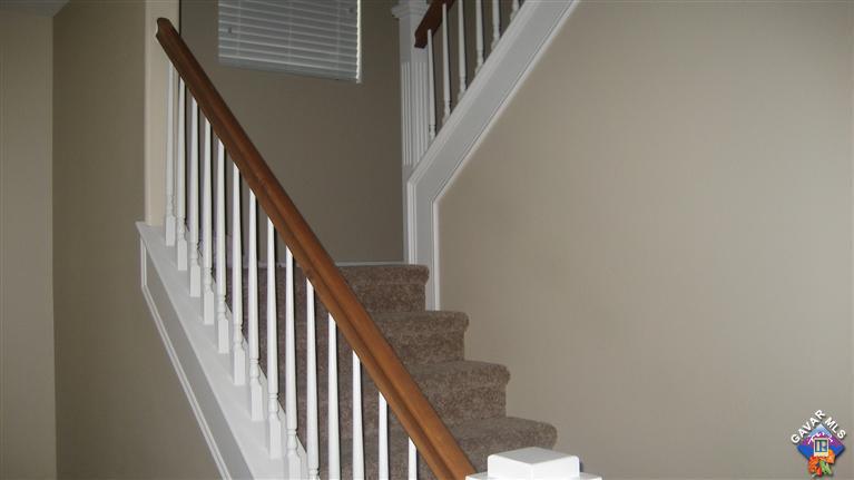44741 Ruthron Avenue Lancaster, CA 93536 - Photo 8 of 18 a view of staircase with railing and white walls