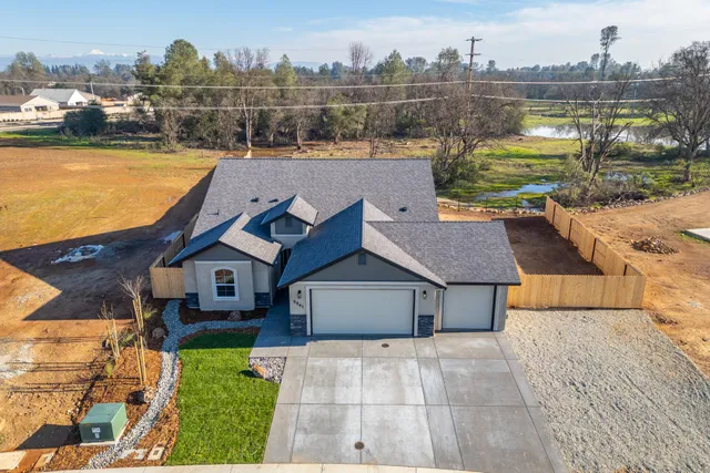 a aerial view of a house with a lake view