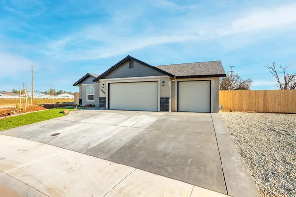a view of garage and yard