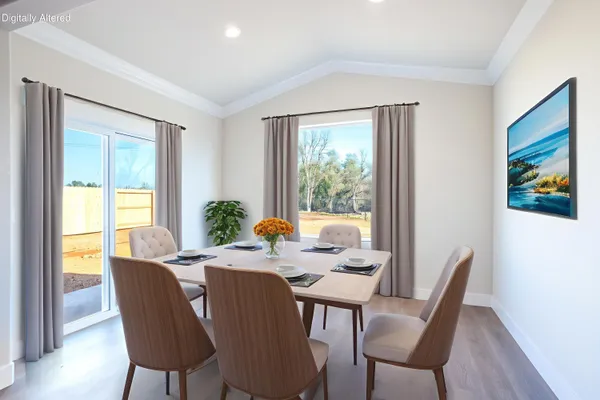 a view of a dining room with furniture window and outside view