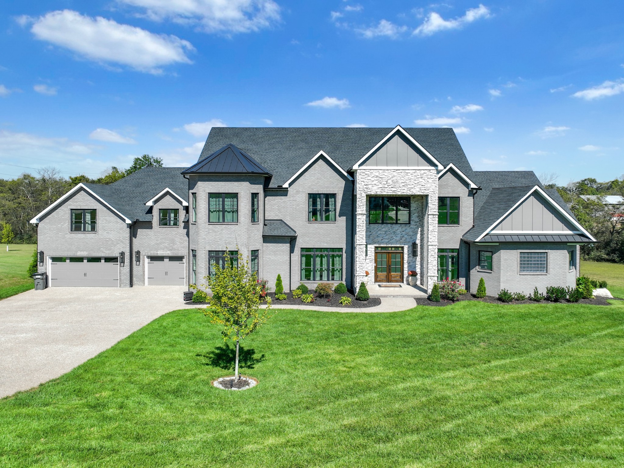 a front view of a house with a yard