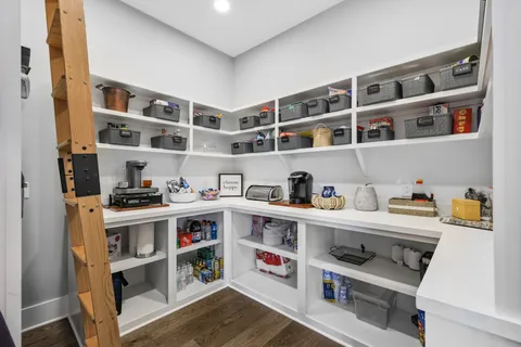 a view of kitchen with cabinets and wooden floor