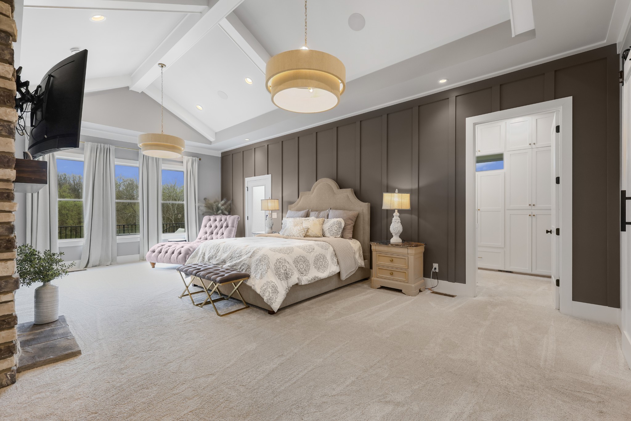 617 Cole's Ferry Road Gallatin, TN 37066 - Photo 16 of 50 a spacious bedroom with a bed a flat screen tv and balcony