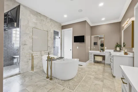 a large living room with stainless steel appliances kitchen island granite countertop a couch and a view of living room