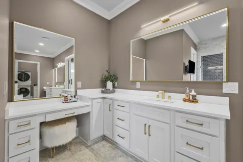 a bathroom with a sink vanity and mirror