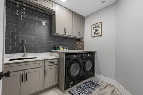 a utility room with dryer and washer