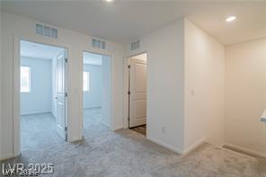12347 Indigo Montage Road, Unit 3 Las Vegas, NV 89183 - Photo 16 of 23 Plush carpeting blankets this versatile bonus room, offering comfortable access to additional living spaces.