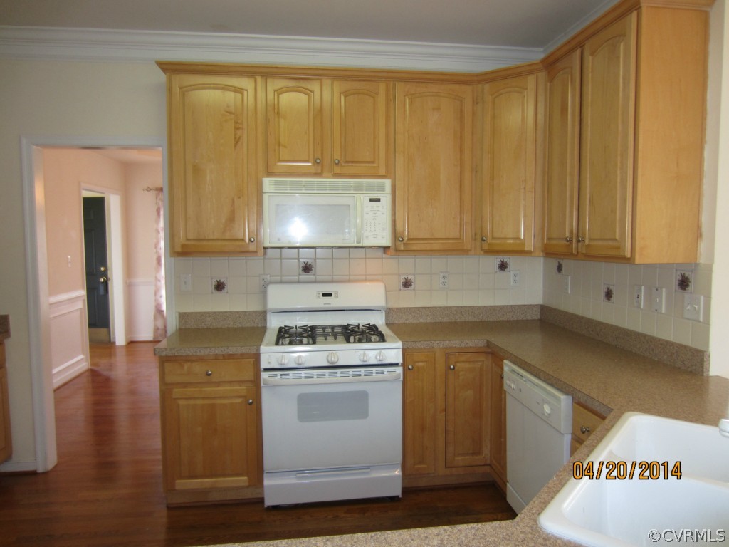 1443 Goswick Ridge Road Midlothian, VA 23114 - Photo 9 of 22 a kitchen with a sink stove and cabinets