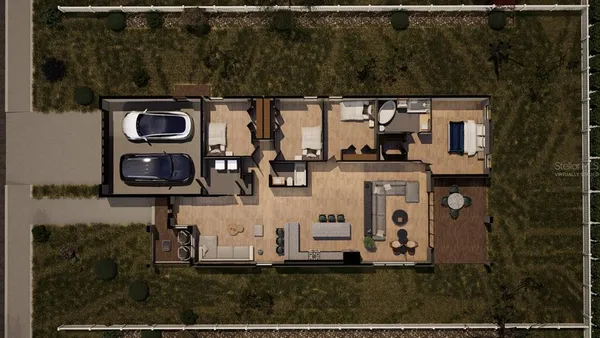 an aerial view of a house with backyard