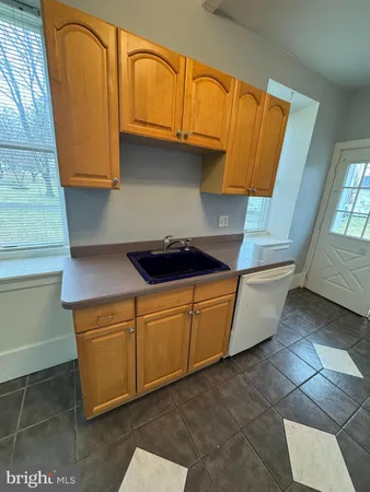a white refrigerator freezer sitting inside of a kitchen