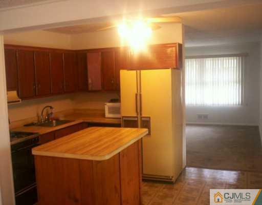 31 Stiles Road Edison, NJ 08817 - Photo 3 of 4 a kitchen with stainless steel appliances a refrigerator and a sink