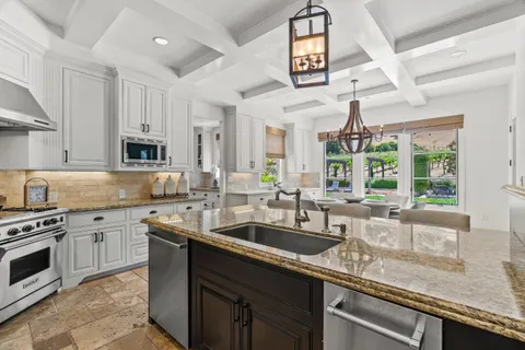 a bed room with a bed and a chair