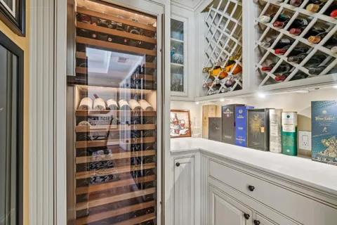 a bedroom with a large bed and a potted plant