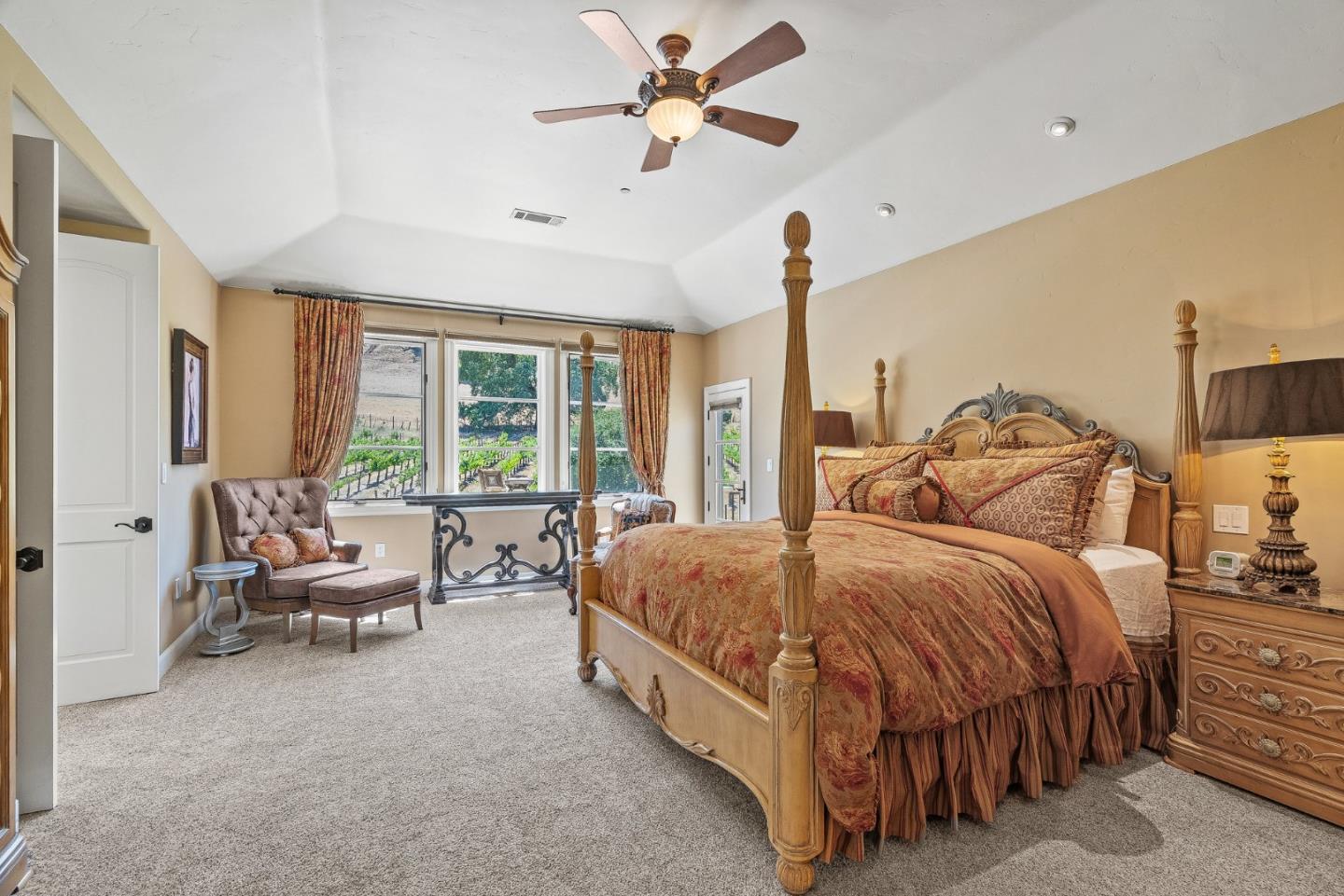1405 Lakeview Court San Martin, CA 95046 - Photo 27 of 83 a bedroom with a bed a chandelier and a large window