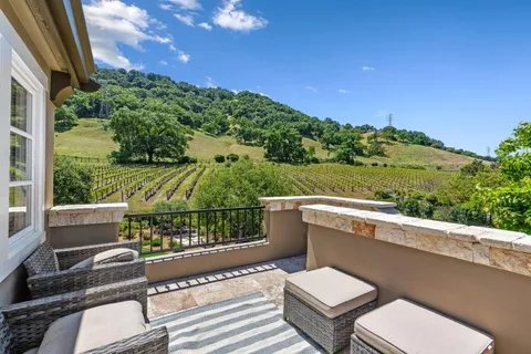 a view of a table and chairs in a room