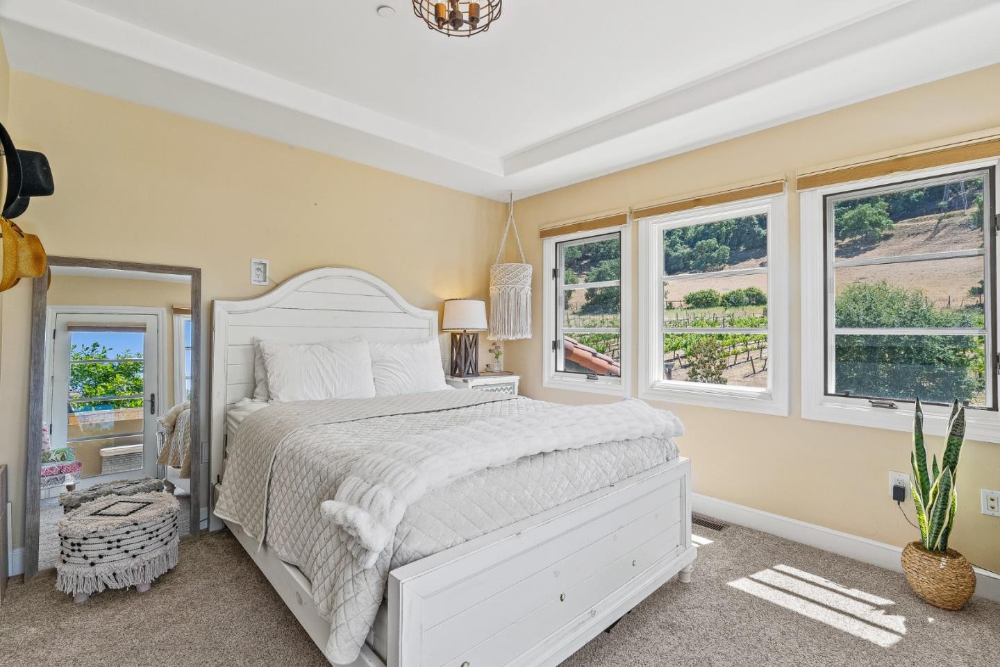 1405 Lakeview Court San Martin, CA 95046 - Photo 37 of 83 a bedroom with a large bed and a potted plant