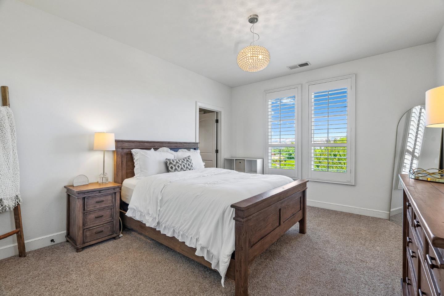 1405 Lakeview Court San Martin, CA 95046 - Photo 38 of 83 a spacious bedroom with a bed and a window