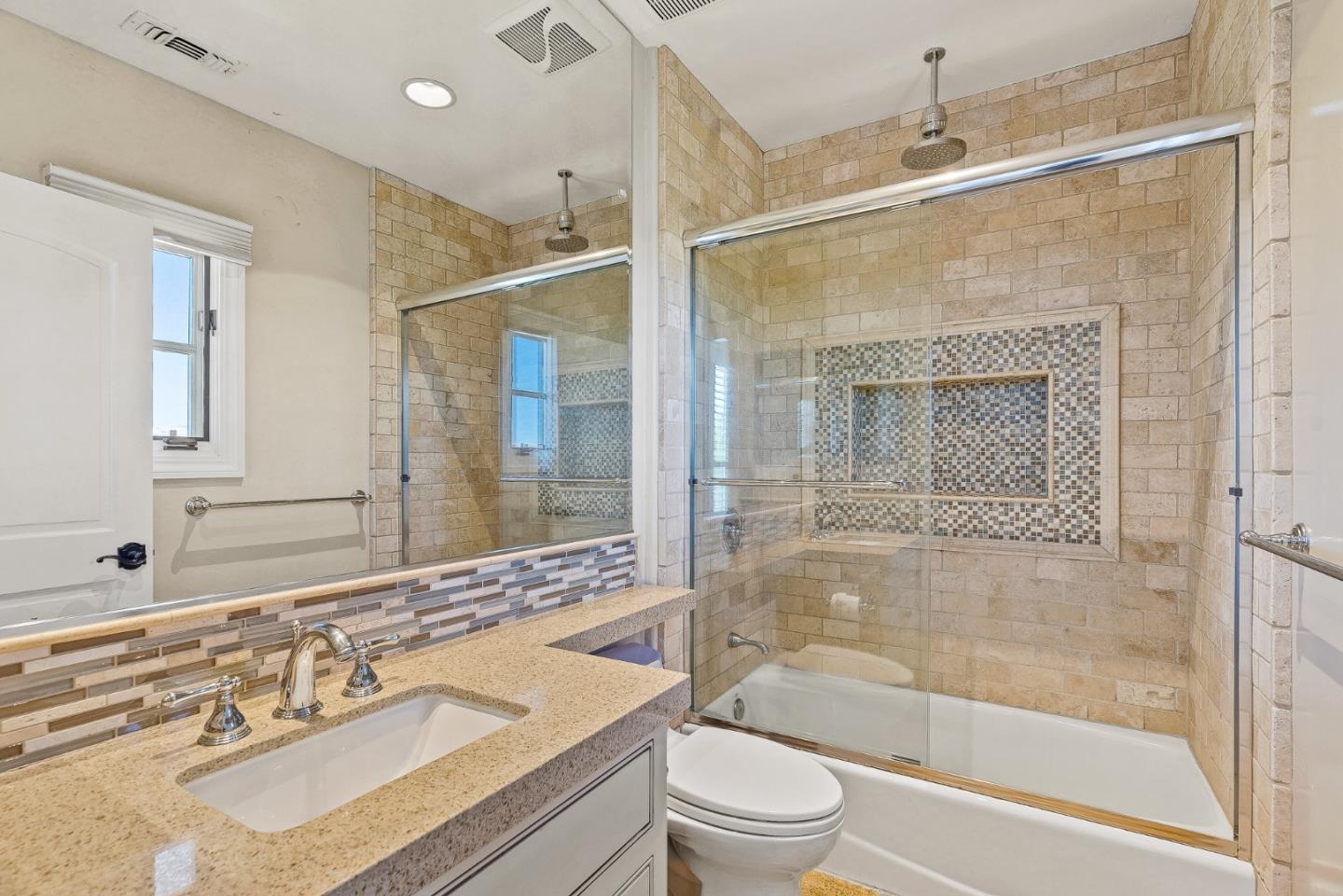1405 Lakeview Court San Martin, CA 95046 - Photo 39 of 83 a bathroom with a bathtub shower sink vanity and toilet