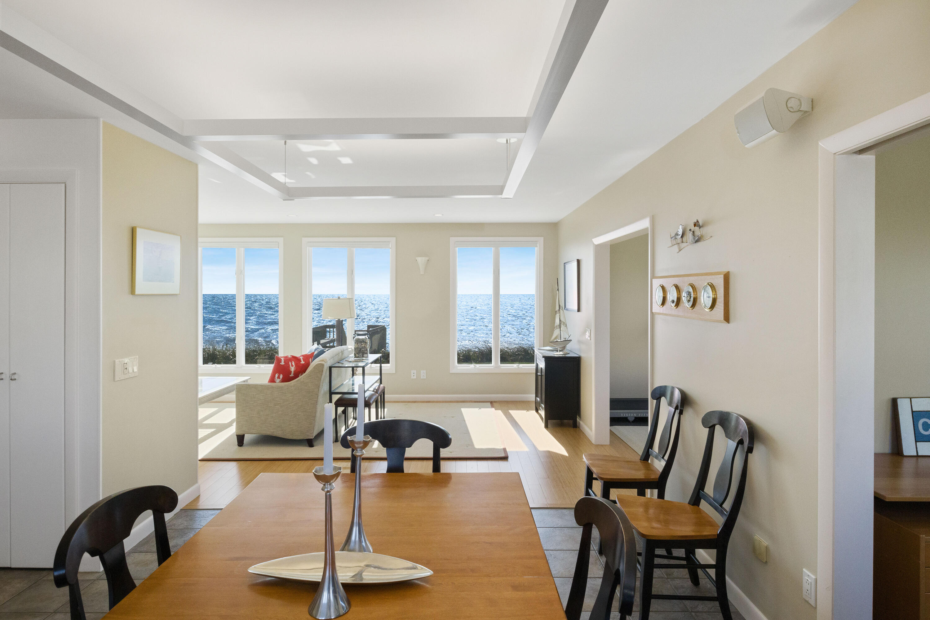 43 Shore Road West Harwich, MA 02671 - Photo 16 of 40 a living room with furniture a dining table and a large window